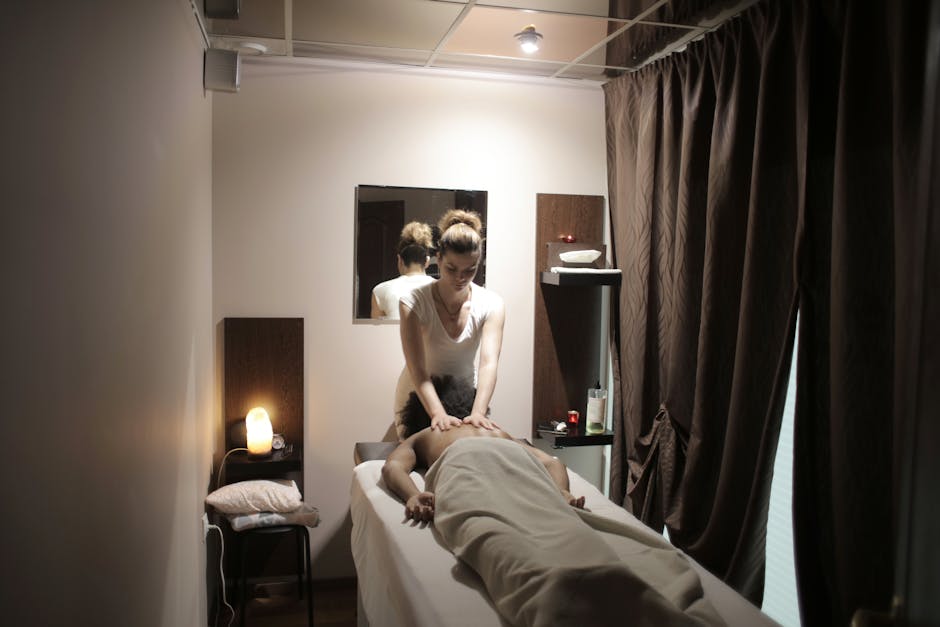 Sustainable Spa Certifications: Green Standards for Wellness Operators professional masseuse in white uniform massaging shoulders a