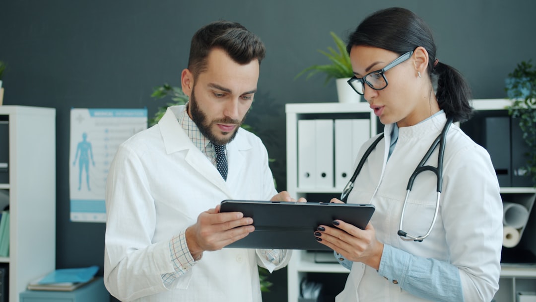 Health Claims and Spa Advertising: Regulatory Compliance in Marketing Two doctors looking at a tablet together